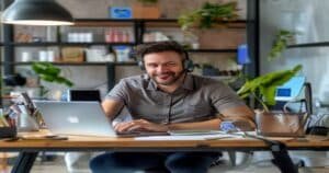 Small business owner at desk using AI phone system to never miss a customer call
